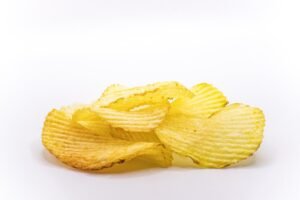 Bags of chips on a table ready for serving at a party, perfect for a gathering of 20 people.